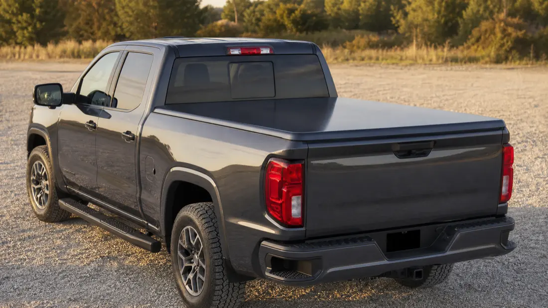 Hinged one-piece tonneau cover on a truck bed
