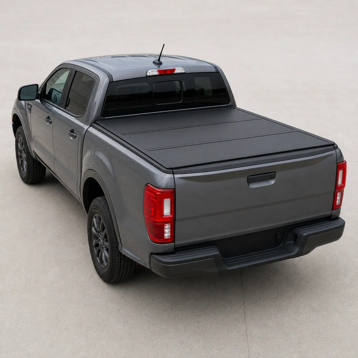 Black BAKFlip G2 hard folding tonneau cover closed flat over a 2021 Ford Ranger bed, rear view