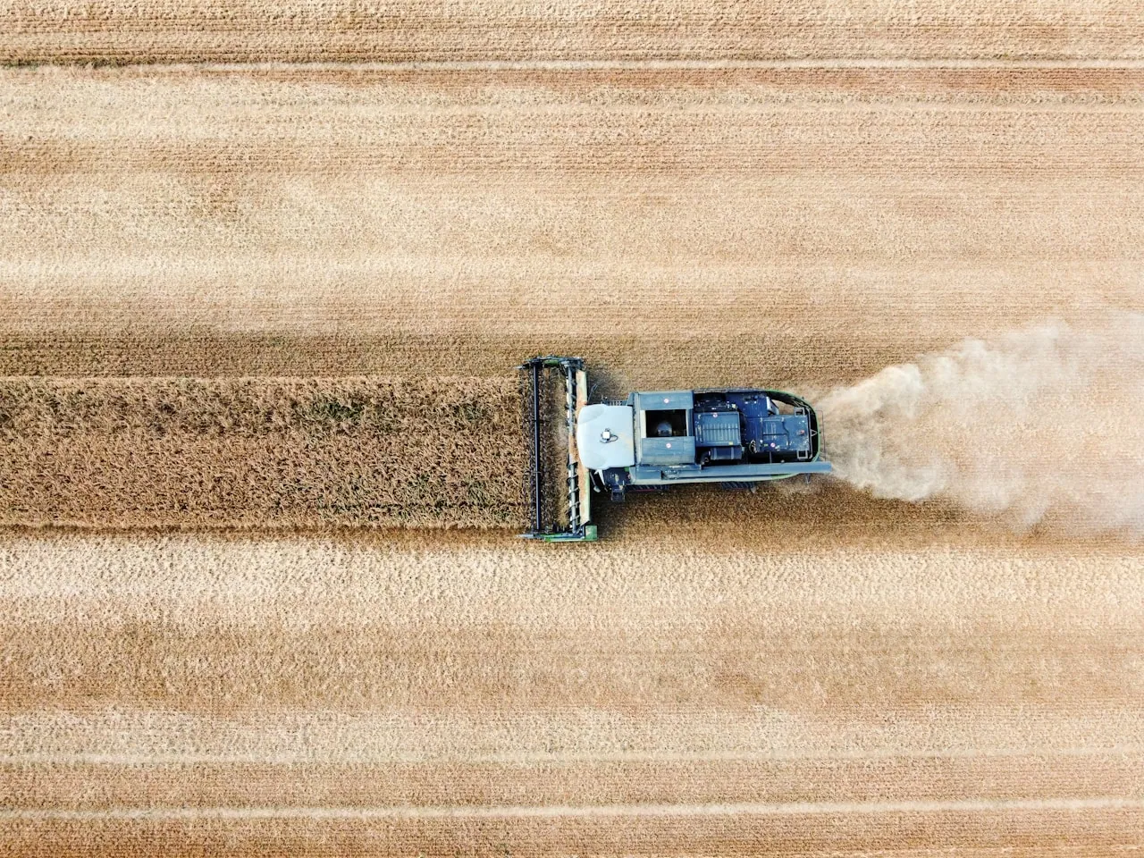 Close-up of a tonneau cover Velcro strip clogged with debris being cleaned with compressed air