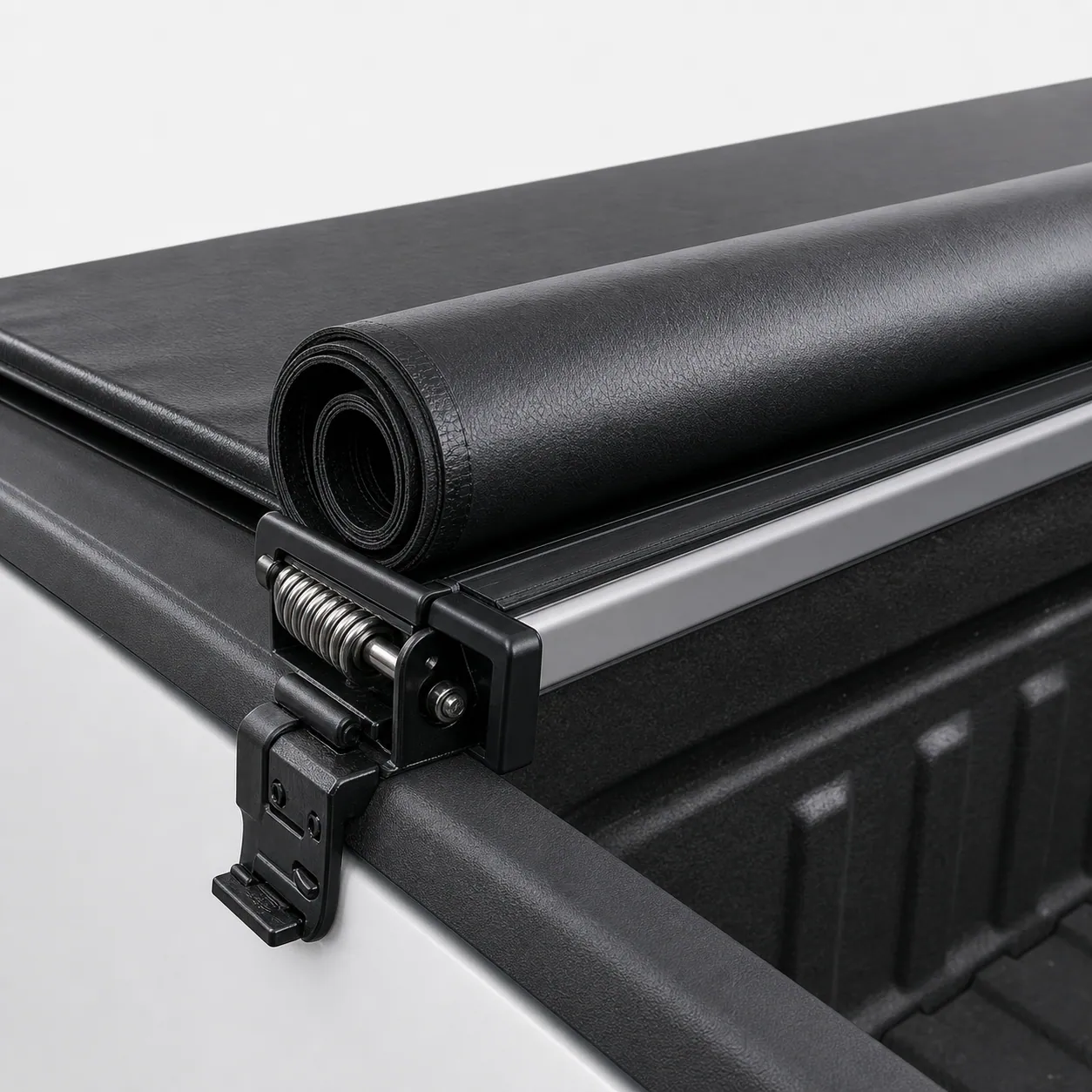 [Front and side product view of a TruXedo TruXport soft roll-up tonneau cover showing the rail and tension hardware]