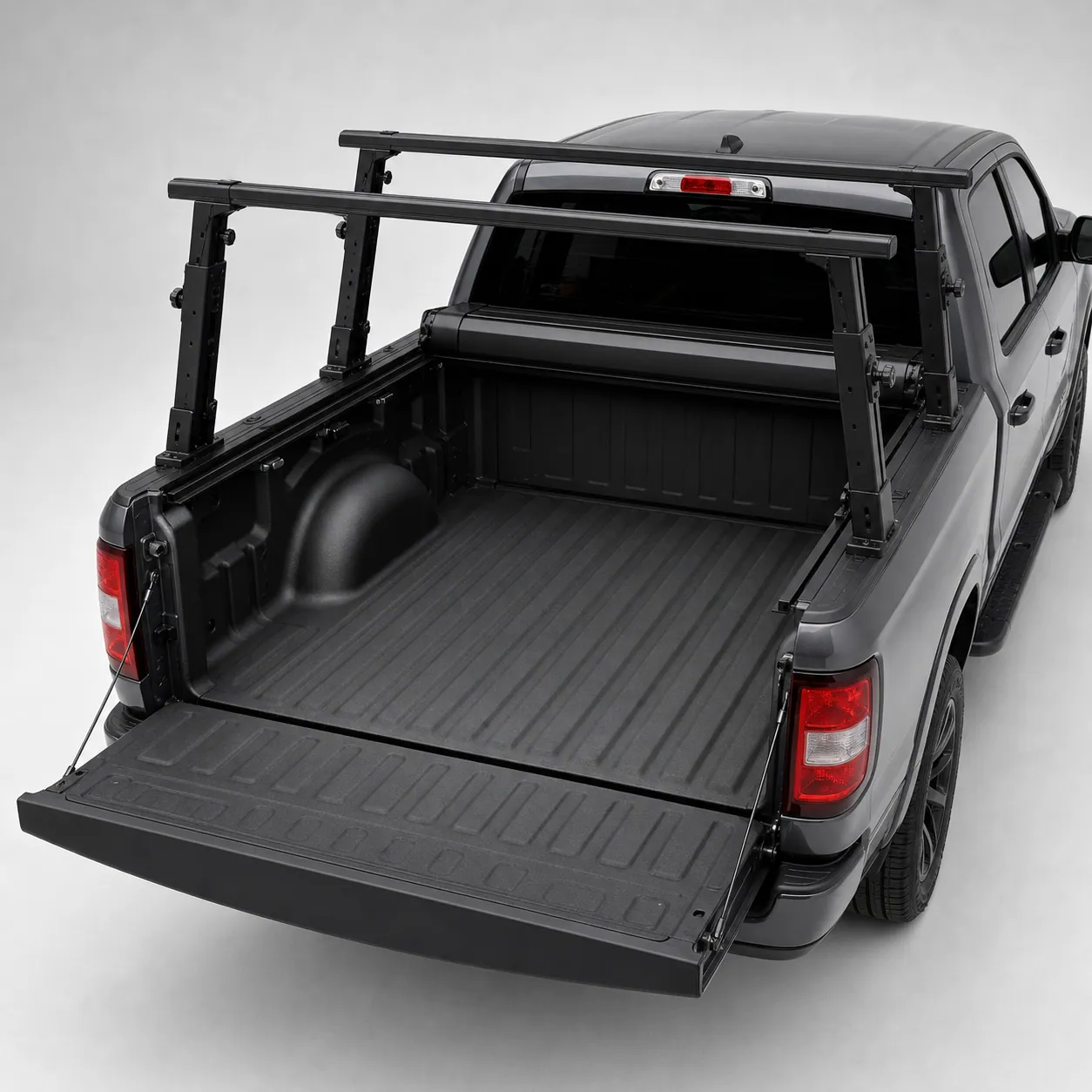 RetraxONE XR retractable cover open into its front canister with a Yakima OverHaul HD rack standing over an empty truck bed