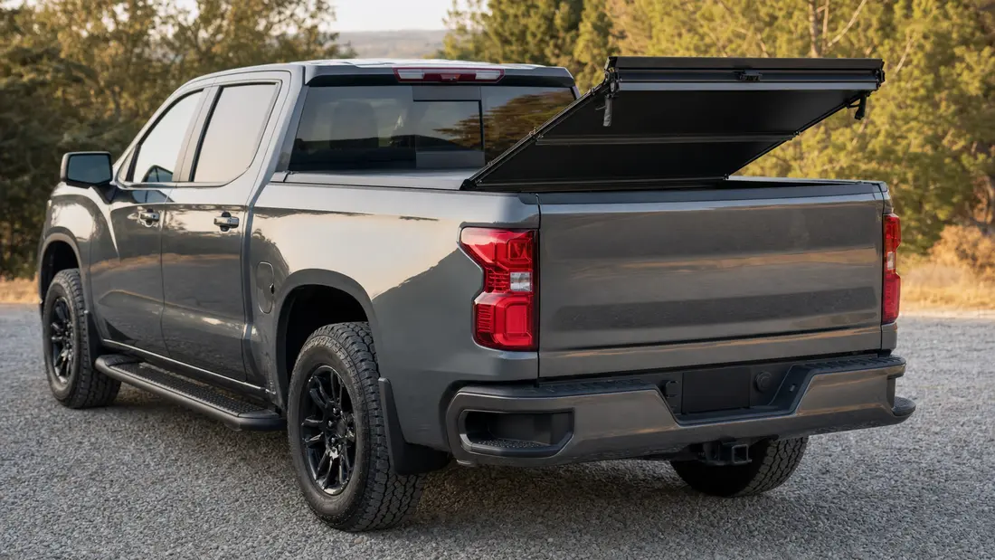 Hard folding aluminum tonneau cover with its rear panel folded up on a full-size truck